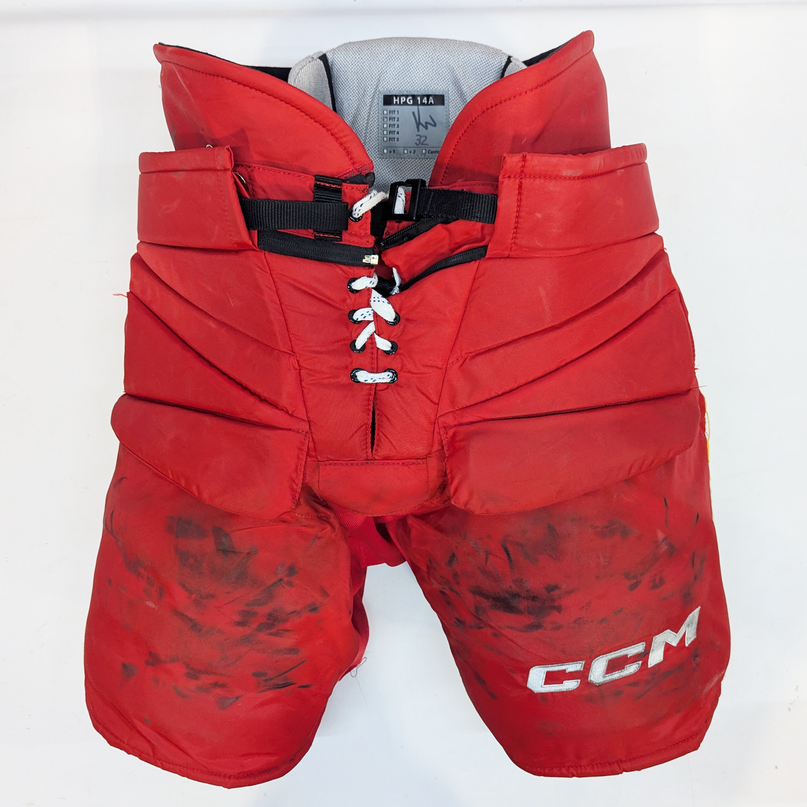 CCM HPG14A - Pantalon de gardien de but de hockey d'occasion de la LNH - Flames de Calgary (rouge/jaune)